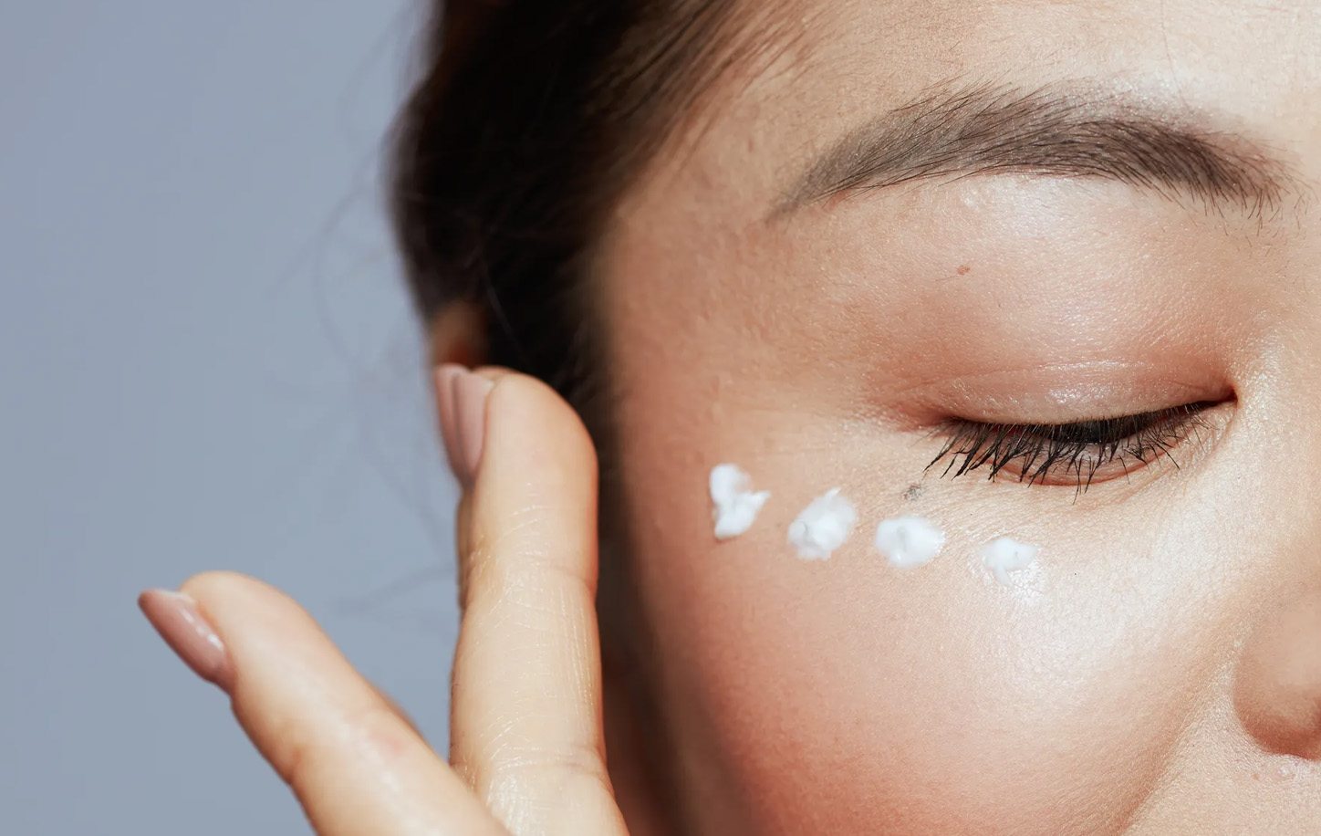 applying eye cream