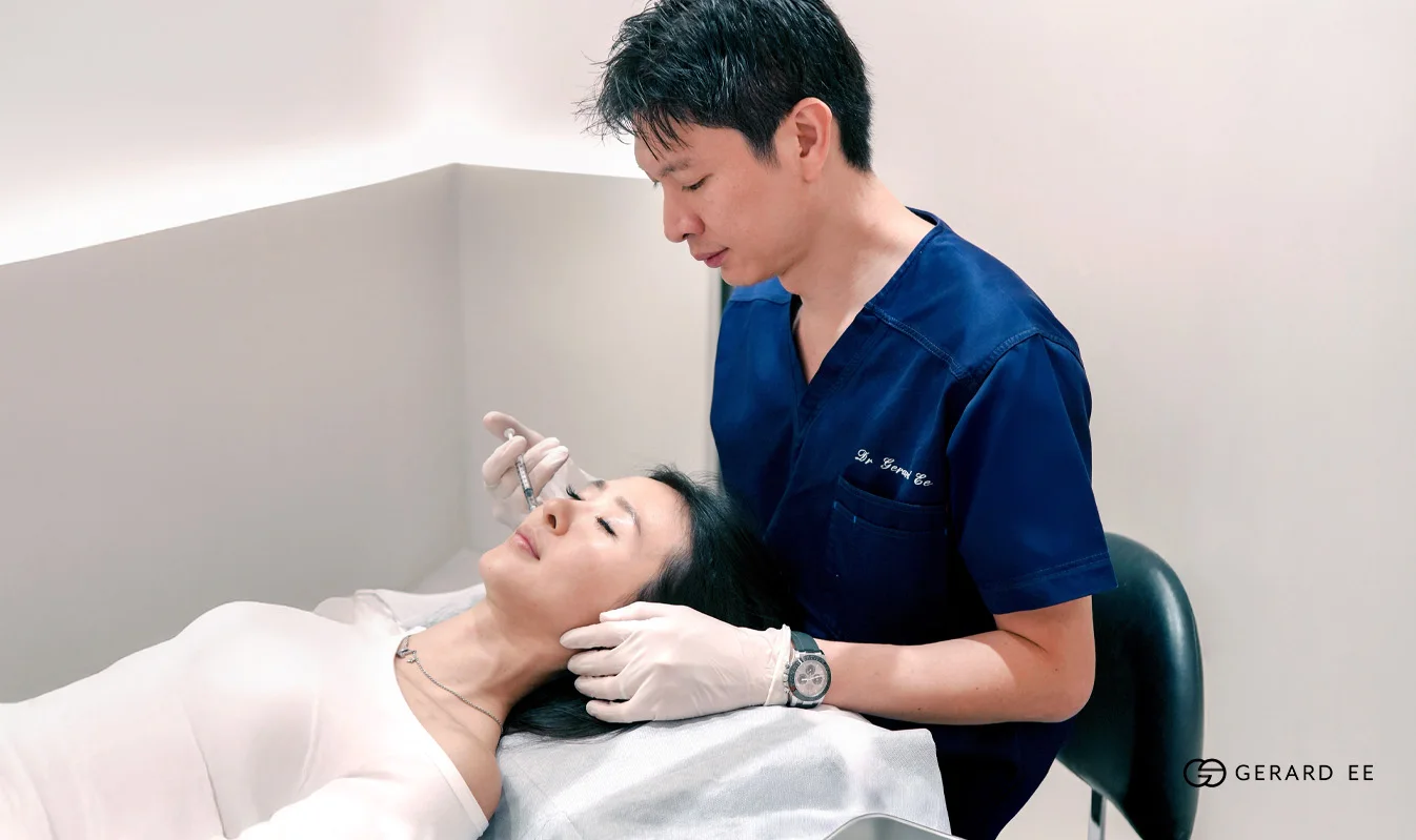 Acne scar treatment cost in Singapore, a doctor treating acne scars on the face