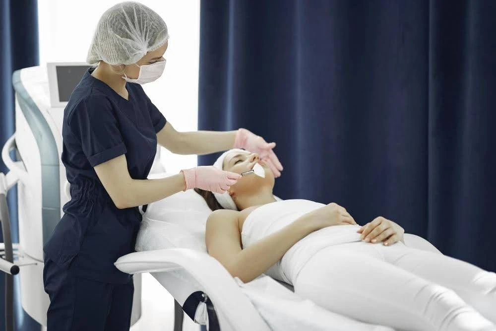 EMFACE applicators placed on the forehead and cheeks